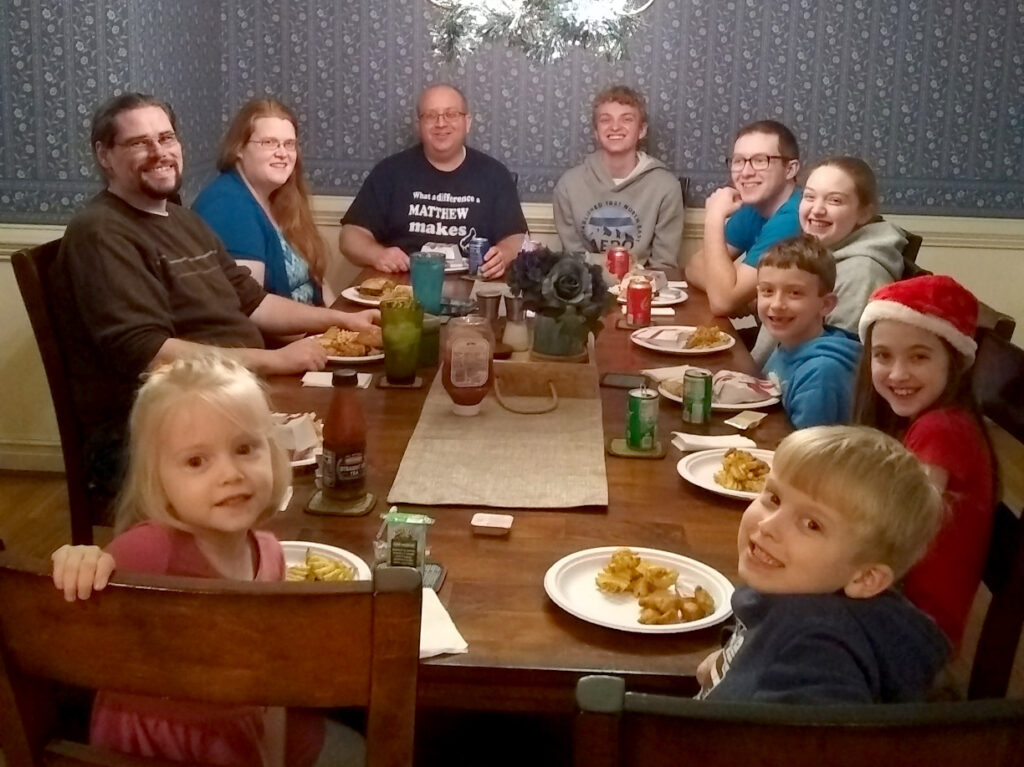 Our family in our dining room enjoying some Chick-fil-A